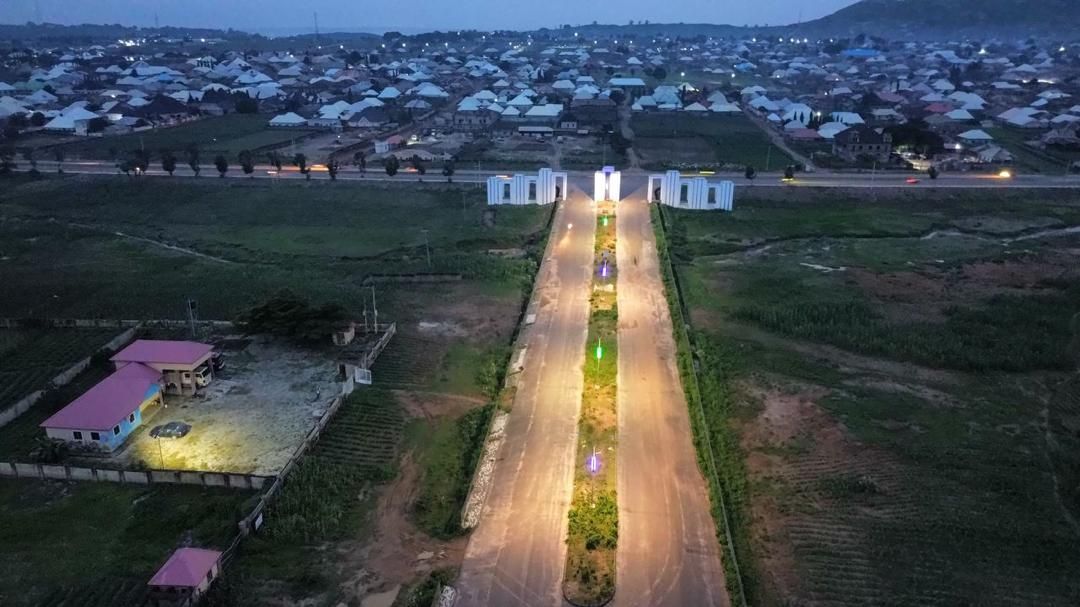 Aerial view of an illuminated boulevard at dusk