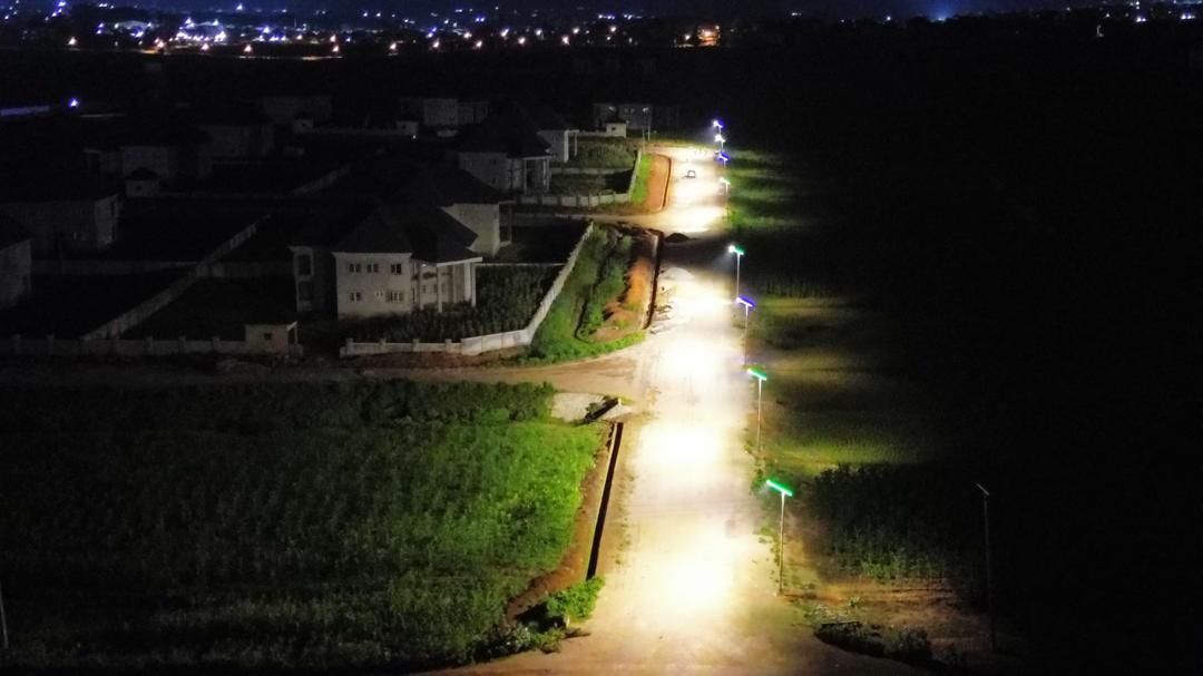 Aerial night view of a lit estate road