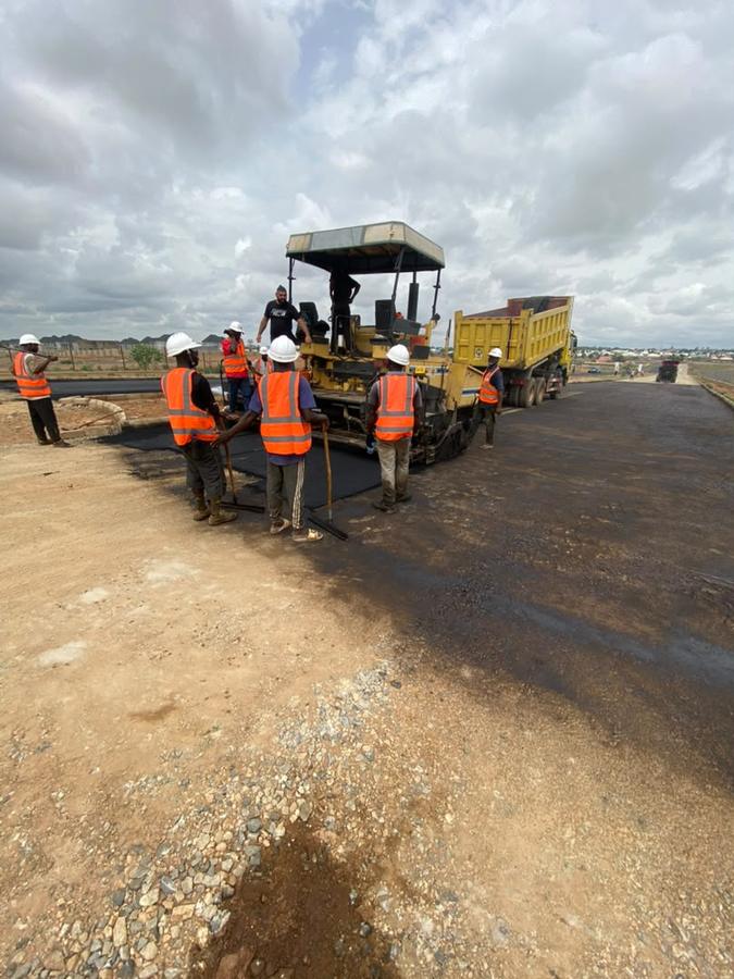 Paving crew working alongside the asphalt paver